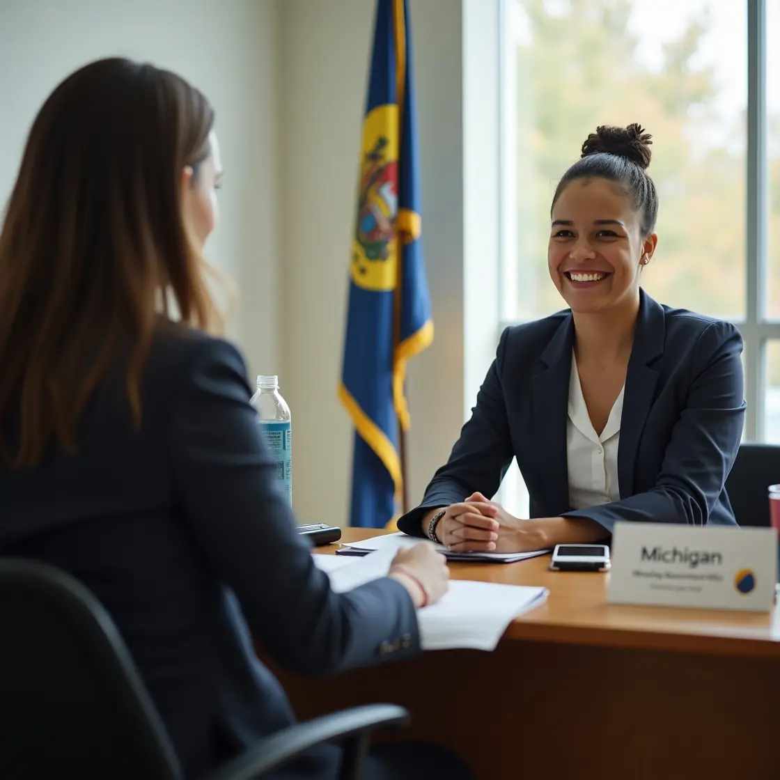 Employee discussing Michigan employment laws with HR manager Employee discussing Michigan employment laws with HR manager