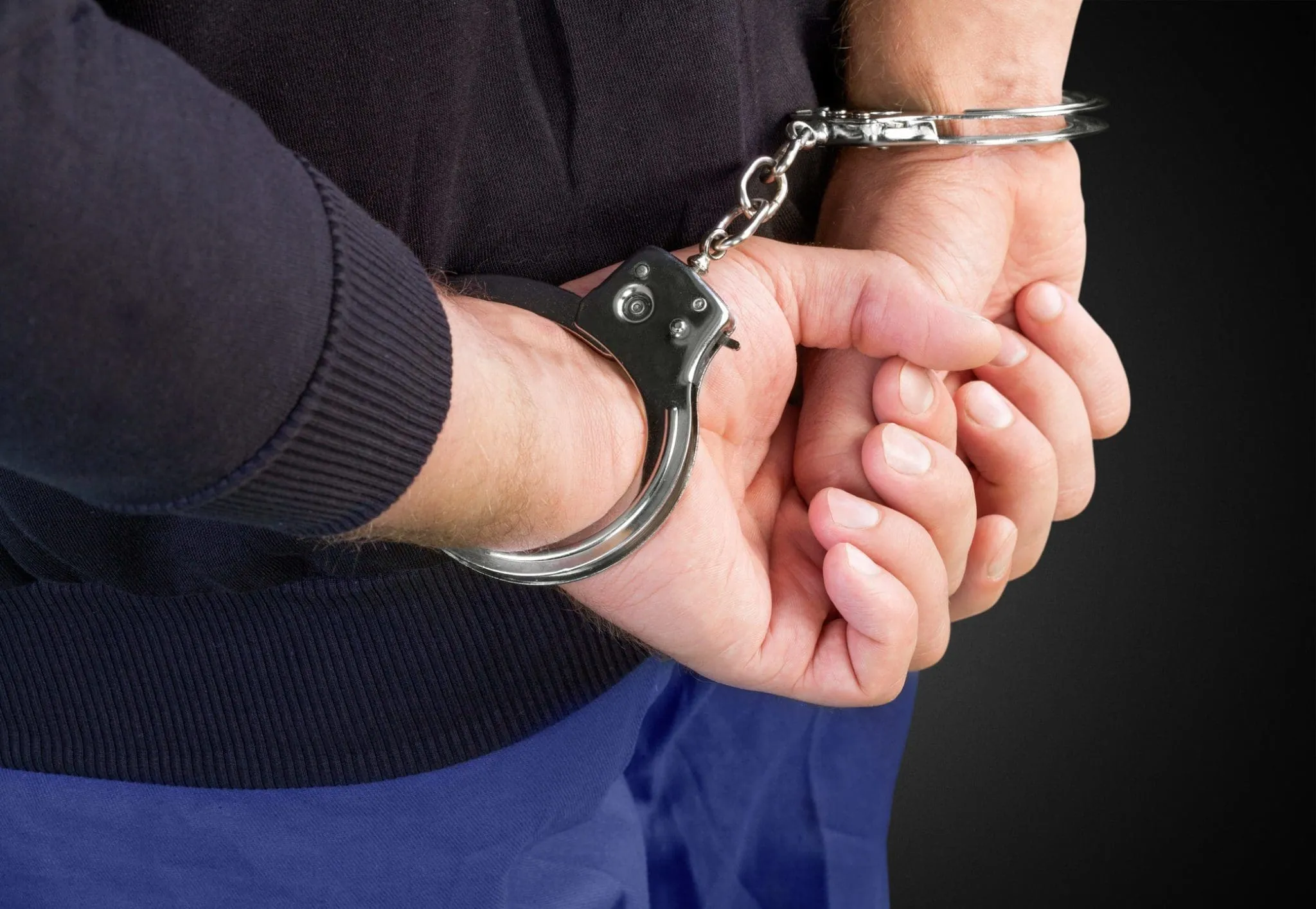 Arrested handcuffed criminal Arrested handcuffed criminal